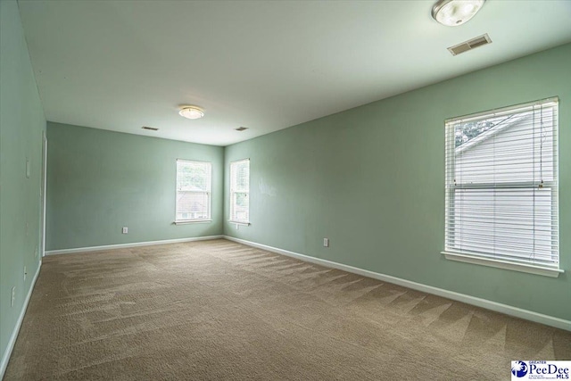 empty room featuring carpet flooring