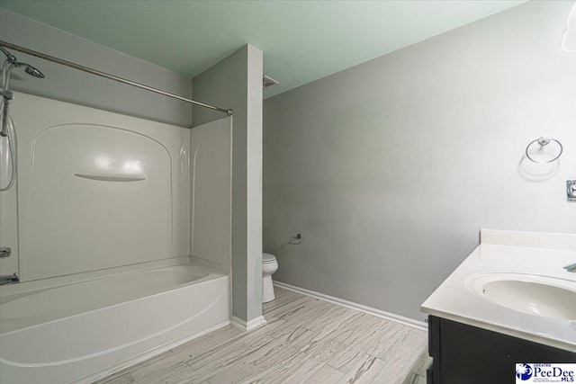 full bathroom with vanity, toilet, shower / washtub combination, and wood-type flooring