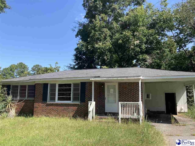 view of front facade with a carport