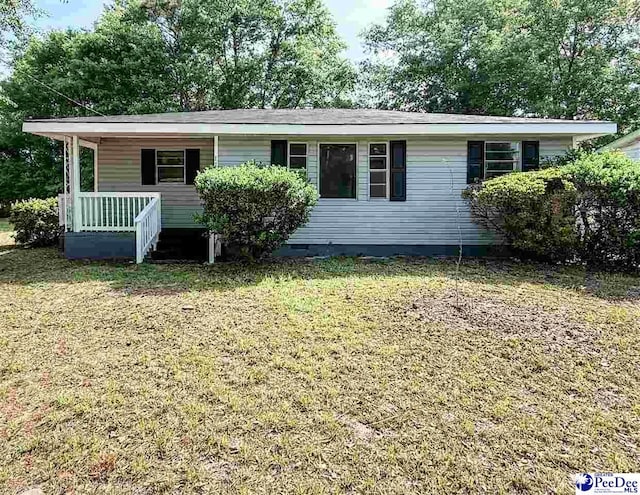 view of front of house with crawl space, covered porch, and a front yard