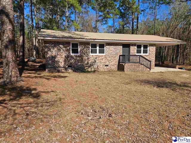 single story home with brick siding and crawl space