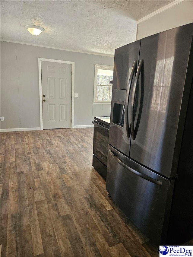 kitchen featuring black range with electric stovetop, a textured ceiling, dark wood-type flooring, and stainless steel refrigerator with ice dispenser