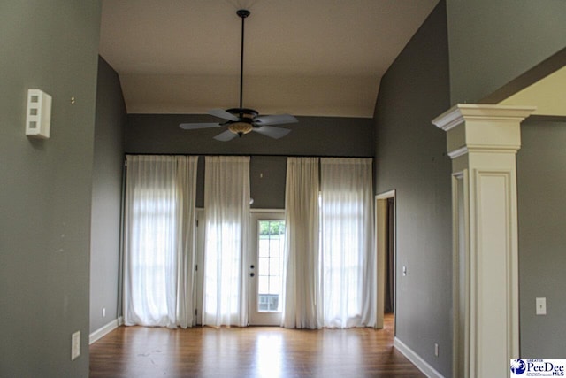 610 Garden Rose Ct, Greer, SC 29651 - unfurnished room featuring ceiling fan, decorative columns, wood finished floors, and lofted ceiling