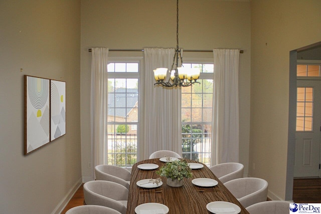 610 Garden Rose Ct, Greer, SC 29651 - dining area featuring a chandelier, plenty of natural light, and wood finished floors