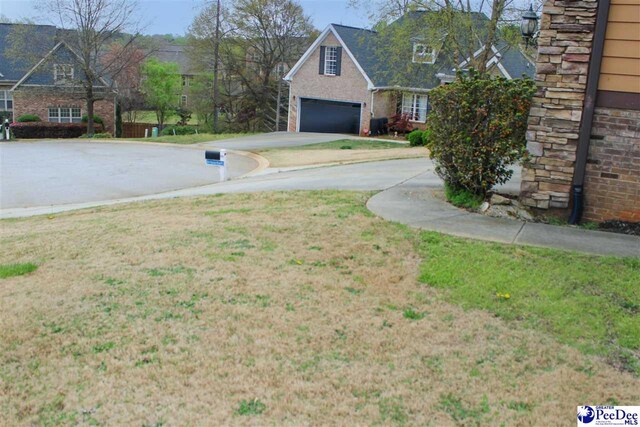 610 Garden Rose Ct, Greer, SC 29651 - view of green lawn featuring driveway
