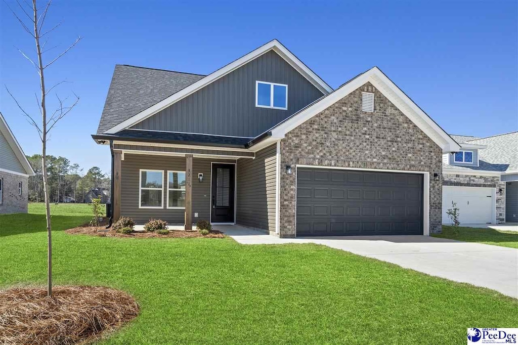 craftsman-style house featuring a garage, a front lawn, roof with shingles, a porch, and driveway