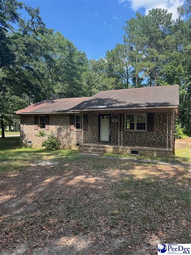 166 Pinestraw Rd, Bennettsville, SC 29512 - view of front of home with crawl space, covered porch, and brick siding