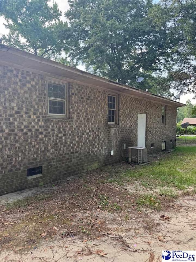 166 Pinestraw Rd, Bennettsville, SC 29512 - view of home's exterior with crawl space and a central AC unit