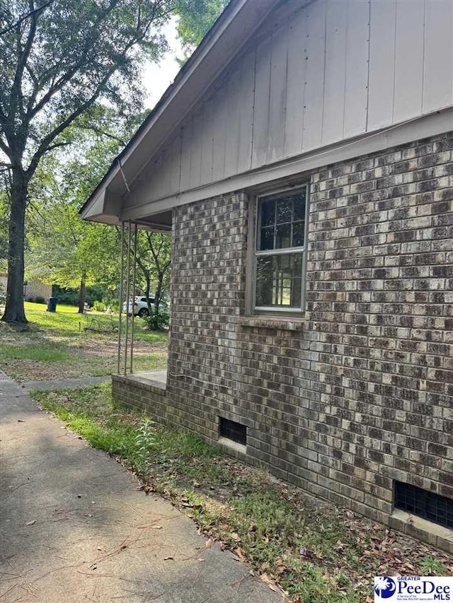 166 Pinestraw Rd, Bennettsville, SC 29512 - view of home's exterior featuring brick siding and crawl space