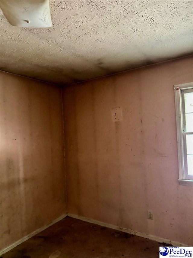 166 Pinestraw Rd, Bennettsville, SC 29512 - empty room with a textured ceiling and baseboards