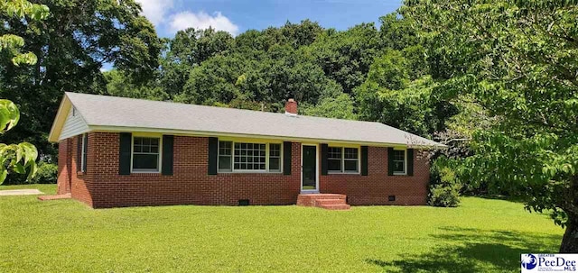 1007 Hamlet Hwy, Bennettsville, SC 29512 - view of front facade featuring a front yard and brick siding