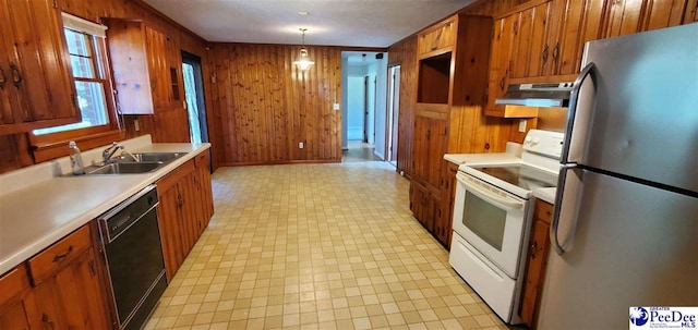 1007 Hamlet Hwy, Bennettsville, SC 29512 - kitchen with freestanding refrigerator, white electric stove, dishwasher, under cabinet range hood, and wooden walls