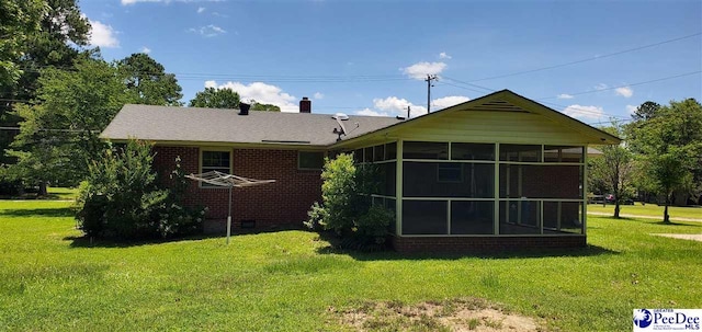 1007 Hamlet Hwy, Bennettsville, SC 29512 - rear view of property with a sunroom, a yard, and brick siding