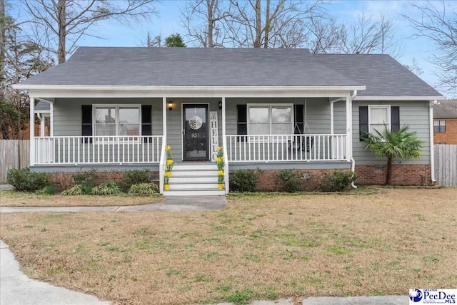 view of front of house with covered porch and a front lawn