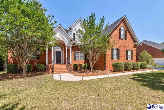 2819 Hermitage Ln, Florence, SC 29501 - traditional-style home with a front yard and brick siding