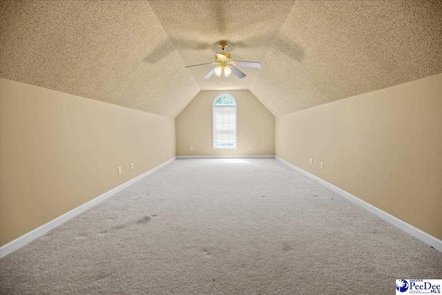 2819 Hermitage Ln, Florence, SC 29501 - bonus room with a ceiling fan, a textured ceiling, lofted ceiling, carpet, and baseboards