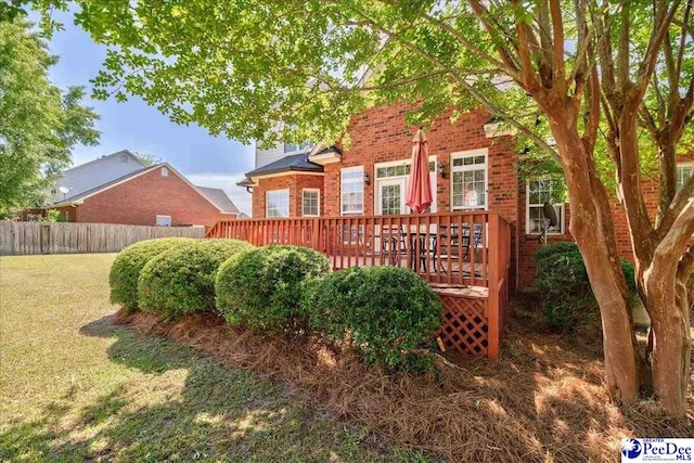 2819 Hermitage Ln, Florence, SC 29501 - rear view of property featuring brick siding and a deck