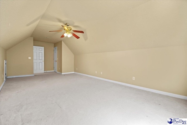 2819 Hermitage Ln, Florence, SC 29501 - additional living space with a ceiling fan, light colored carpet, vaulted ceiling, and baseboards