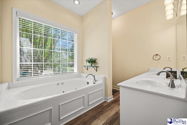 2819 Hermitage Ln, Florence, SC 29501 - full bathroom featuring healthy amount of natural light, wood finished floors, a whirlpool tub, and baseboards