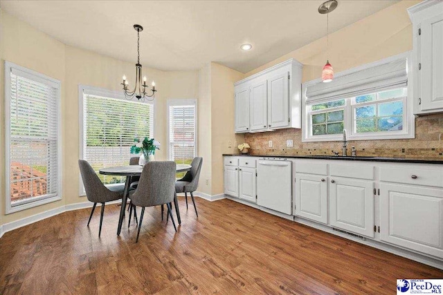 2819 Hermitage Ln, Florence, SC 29501 - dining space featuring a chandelier, wood finished floors, baseboards, and recessed lighting