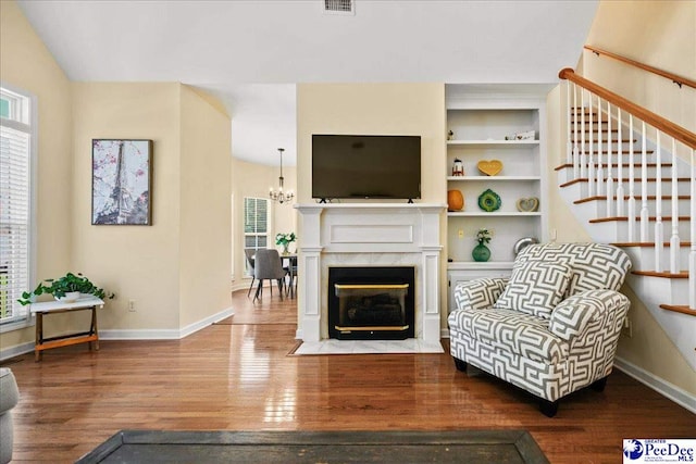 2819 Hermitage Ln, Florence, SC 29501 - living area featuring plenty of natural light, wood finished floors, and stairs