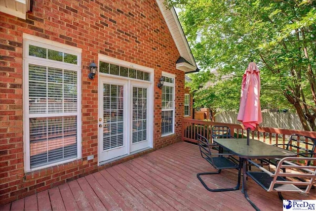 2819 Hermitage Ln, Florence, SC 29501 - wooden terrace featuring outdoor dining space and fence