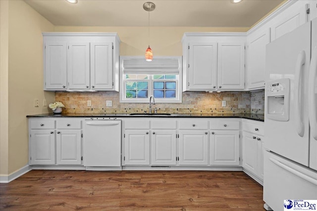 2819 Hermitage Ln, Florence, SC 29501 - kitchen with white appliances, a sink, dark countertops, white cabinets, and recessed lighting