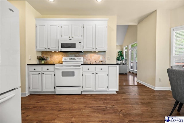 2819 Hermitage Ln, Florence, SC 29501 - kitchen featuring white appliances, dark countertops, decorative backsplash, white cabinetry, and recessed lighting