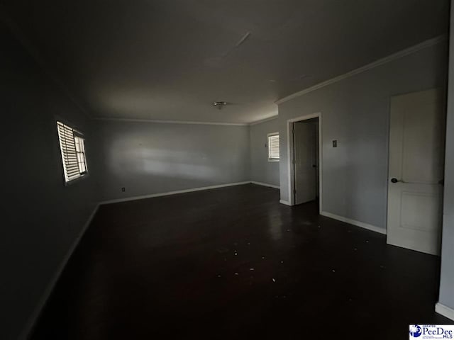 unfurnished room with plenty of natural light and ornamental molding