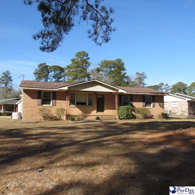 ranch-style house with a front lawn