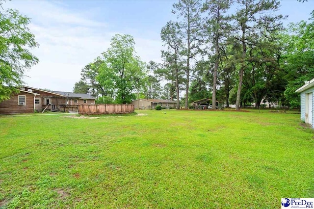 1017 Big Swamp Rd, Pamplico, SC 29583 - view of grassy yard with a wooden deck