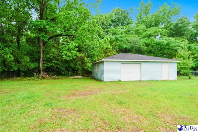 1017 Big Swamp Rd, Pamplico, SC 29583 - view of green lawn with a garage and an outbuilding
