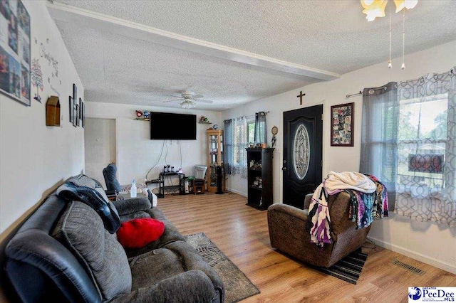 1017 Big Swamp Rd, Pamplico, SC 29583 - living room with a ceiling fan, a textured ceiling, wood finished floors, and baseboards