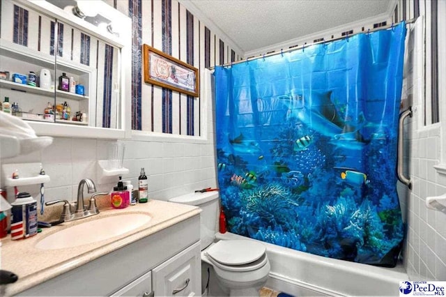 1017 Big Swamp Rd, Pamplico, SC 29583 - full bath with a textured ceiling, toilet, shower / bath combo with shower curtain, tile walls, and vanity
