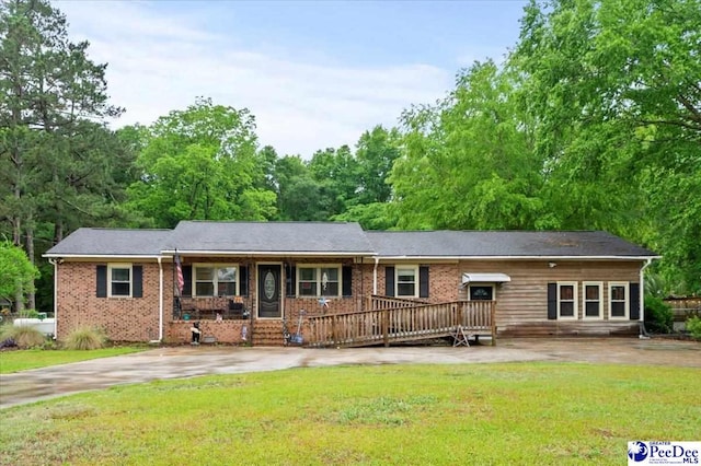 1017 Big Swamp Rd, Pamplico, SC 29583 - ranch-style home with a front lawn, brick siding, and a porch