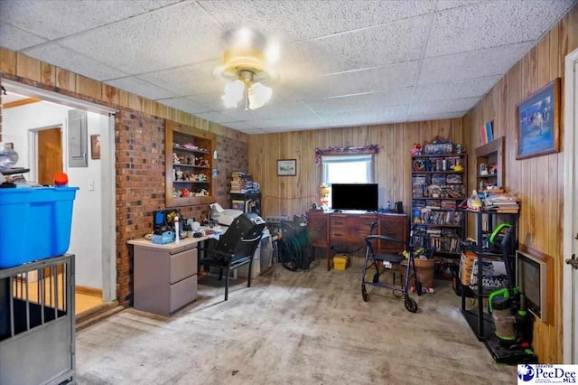 1017 Big Swamp Rd, Pamplico, SC 29583 - office space featuring wood walls, a ceiling fan, and concrete flooring