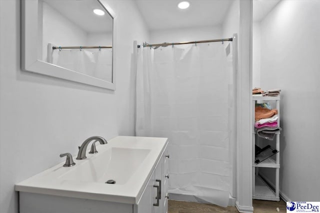1017 Big Swamp Rd, Pamplico, SC 29583 - bathroom with vanity, recessed lighting, a shower with curtain, and wood finished floors