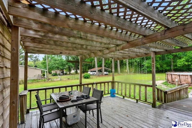 1017 Big Swamp Rd, Pamplico, SC 29583 - wooden terrace featuring outdoor dining space, a yard, and a pergola