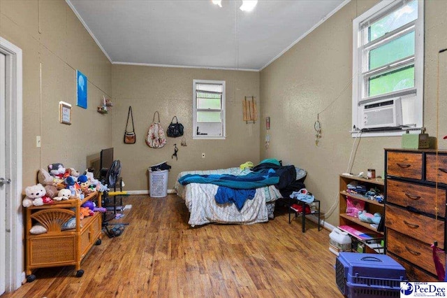 1017 Big Swamp Rd, Pamplico, SC 29583 - bedroom featuring crown molding, wood finished floors, and cooling unit