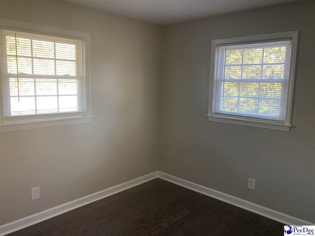 spare room featuring a healthy amount of sunlight