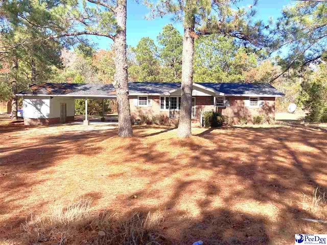 view of front of home featuring a carport