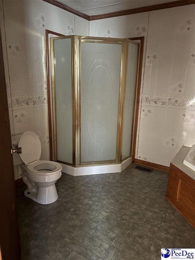 bathroom featuring ornamental molding, visible vents, a shower stall, and toilet