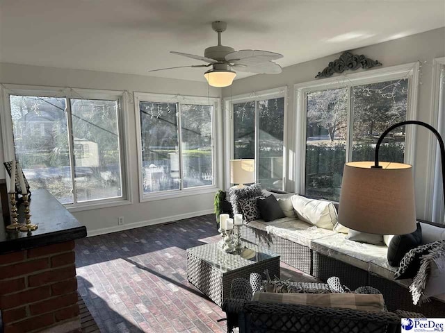 sunroom / solarium with ceiling fan