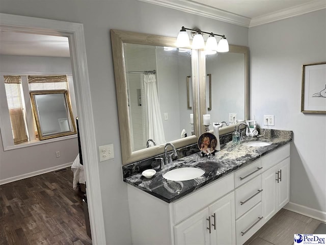 bathroom with vanity, wood-type flooring, and ornamental molding