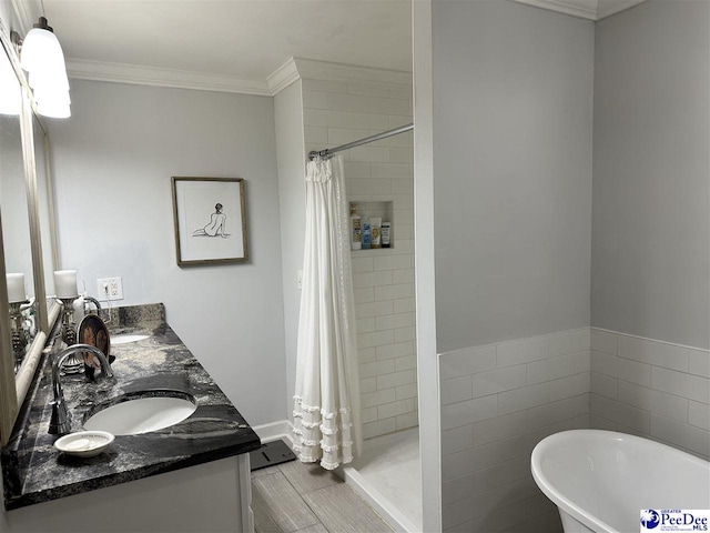 bathroom with shower with separate bathtub, ornamental molding, tile walls, and vanity