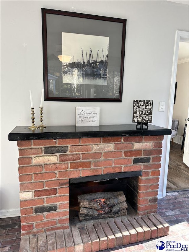 room details featuring a brick fireplace