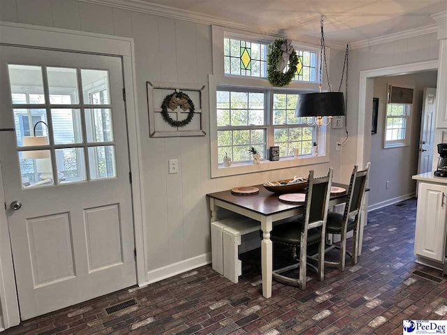 dining room with ornamental molding