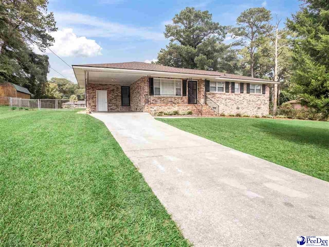 view of front of house featuring a carport and a front lawn