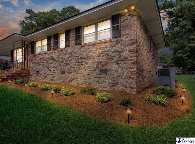 view of property exterior at dusk