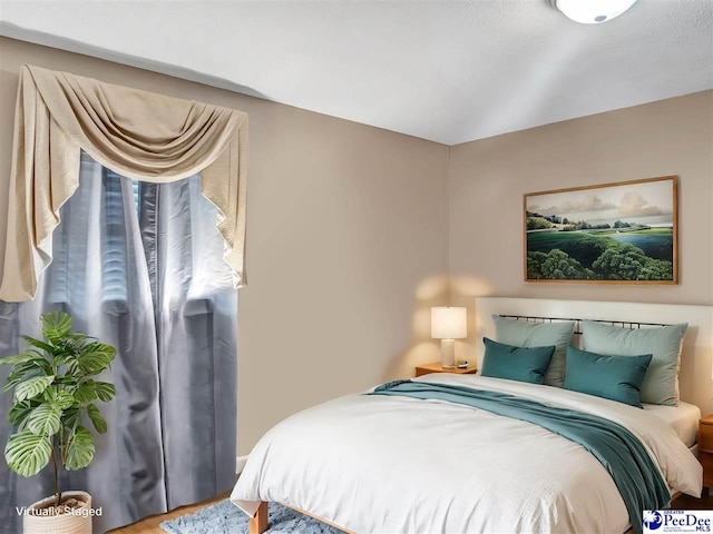 bedroom with vaulted ceiling